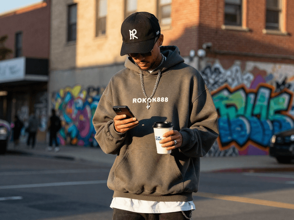 Stylish individual showcasing rokok 88 exclusive merchandise in vibrant urban setting.